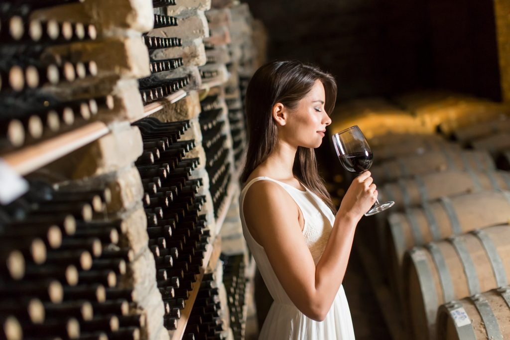 young woman wine cellar